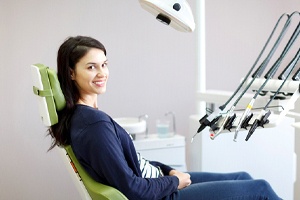 Woman visiting a dentist for a smile makeover in Plano.