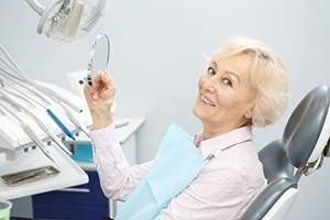 Woman smiles after getting dental bridges in Plano