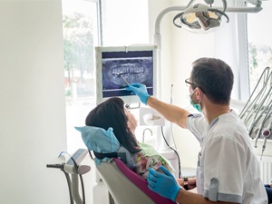 dentist pointing at an X-ray