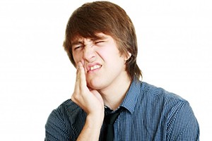 A young man with tooth pain.