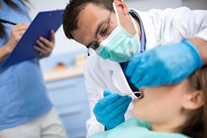 A dentist performing an exam.