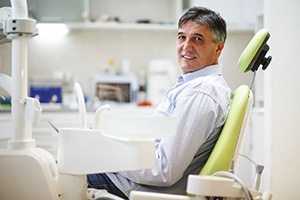Smiling male patient before tooth extractions in Plano