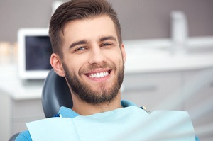 Man smiling with dental implants in Plano, TX