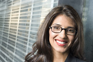 woman with glasses smiling