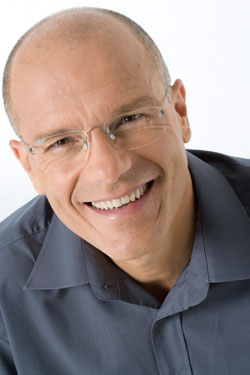 man with glasses smiling