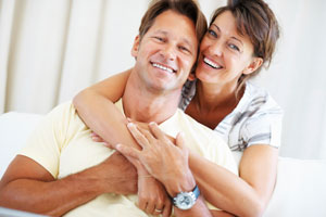 wife wrapping arms around husband