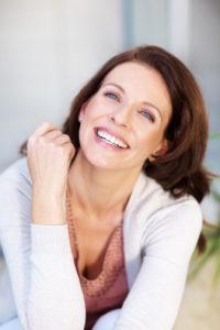 laughing woman with a beautiful smile thanks to CEREC in Plano