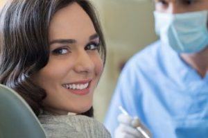 Smiling woman in the dental chair 