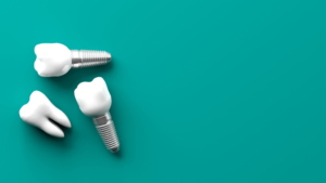 a closeup of dental implants against a green background